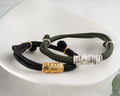 Men's paracord bracelet with personalized engraved beads, handmade by Artizian