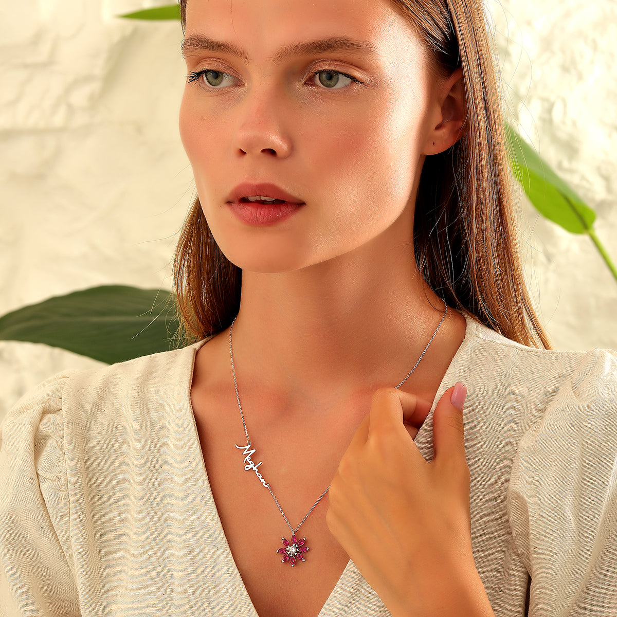 Name necklace with birth flower birthstone charm, crafted in the Artizian studio