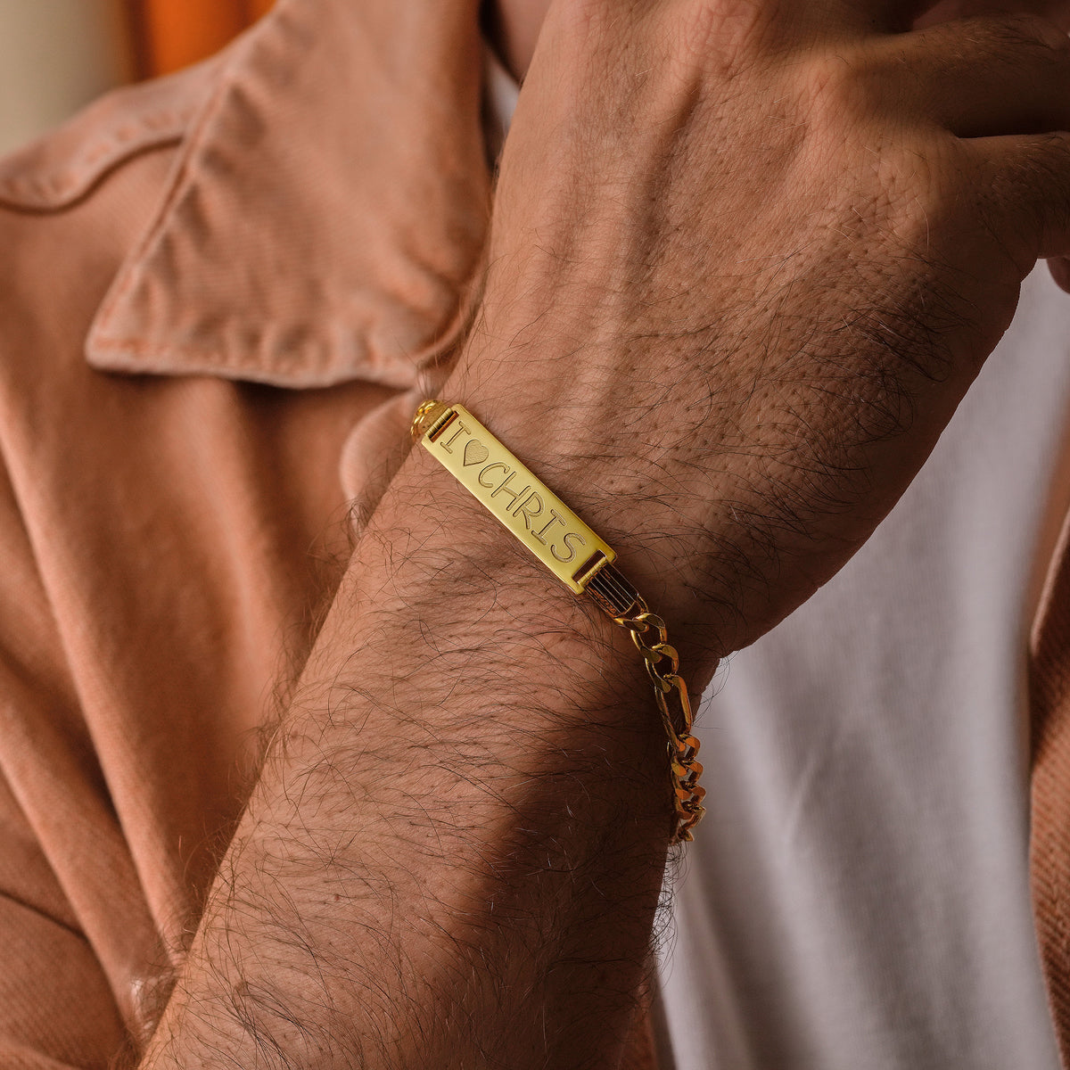 Men's sterling silver Figaro ID bracelet with engraved name plate, a personalized jewelry gift