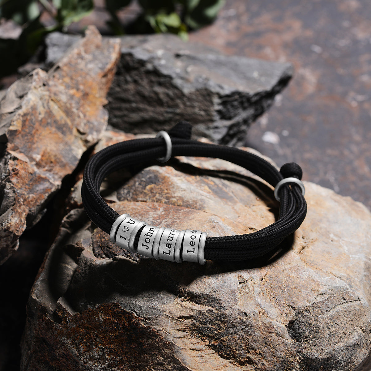 Men's paracord bracelet with personalized engraved beads, a personalized jewelry gift